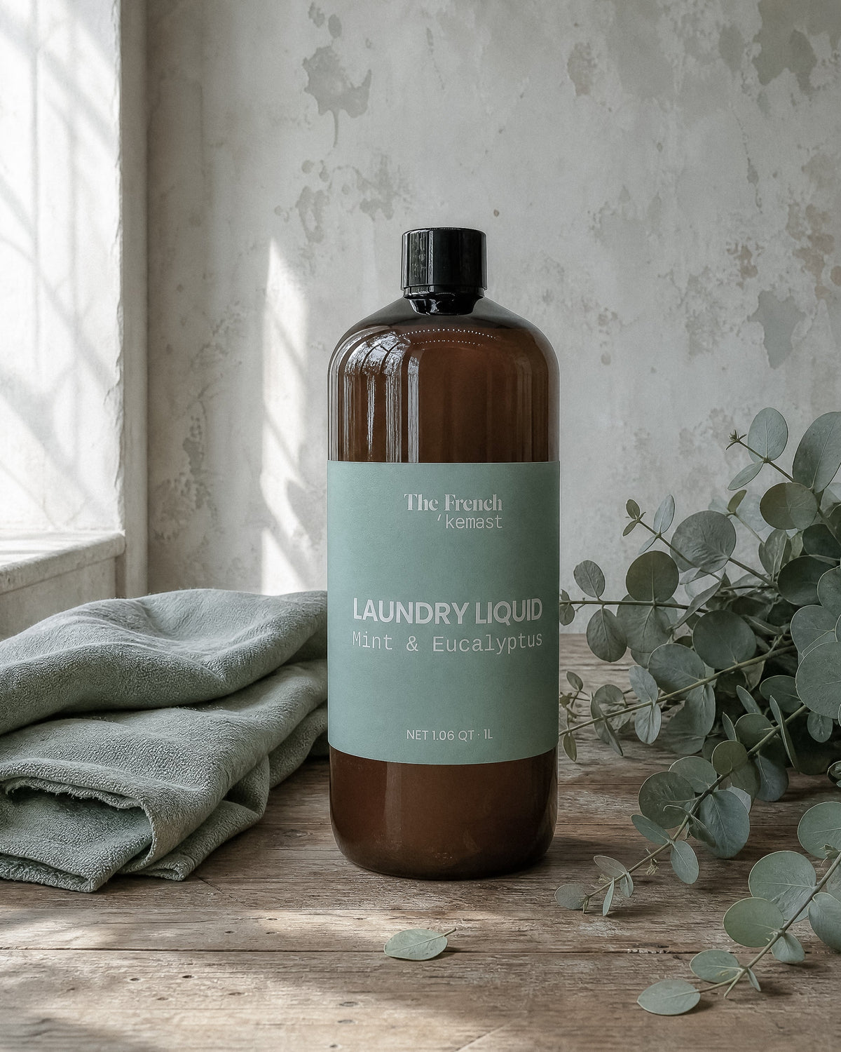 The French Kemest Mint and Eucalyptus laundry liquid on a laundry shelf